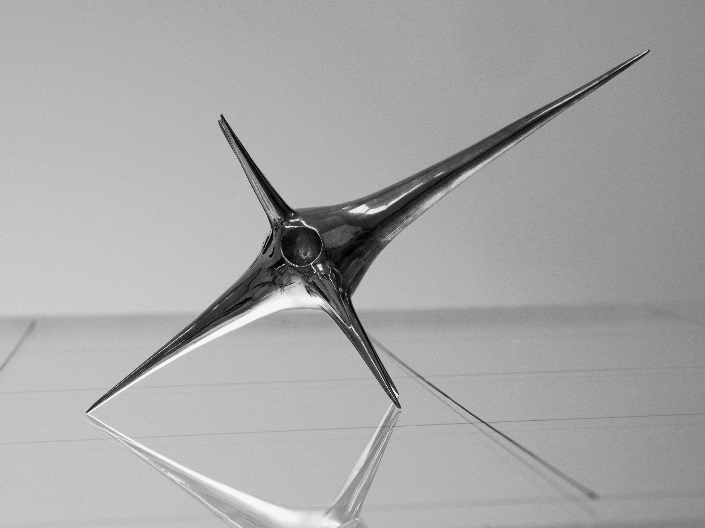 Harmonic Oscillators, art by Pilar Zeta, bronze resting pendulum sculpture photographed for L'Officiel Ibiza, 2026. Photo: Txema Yeste