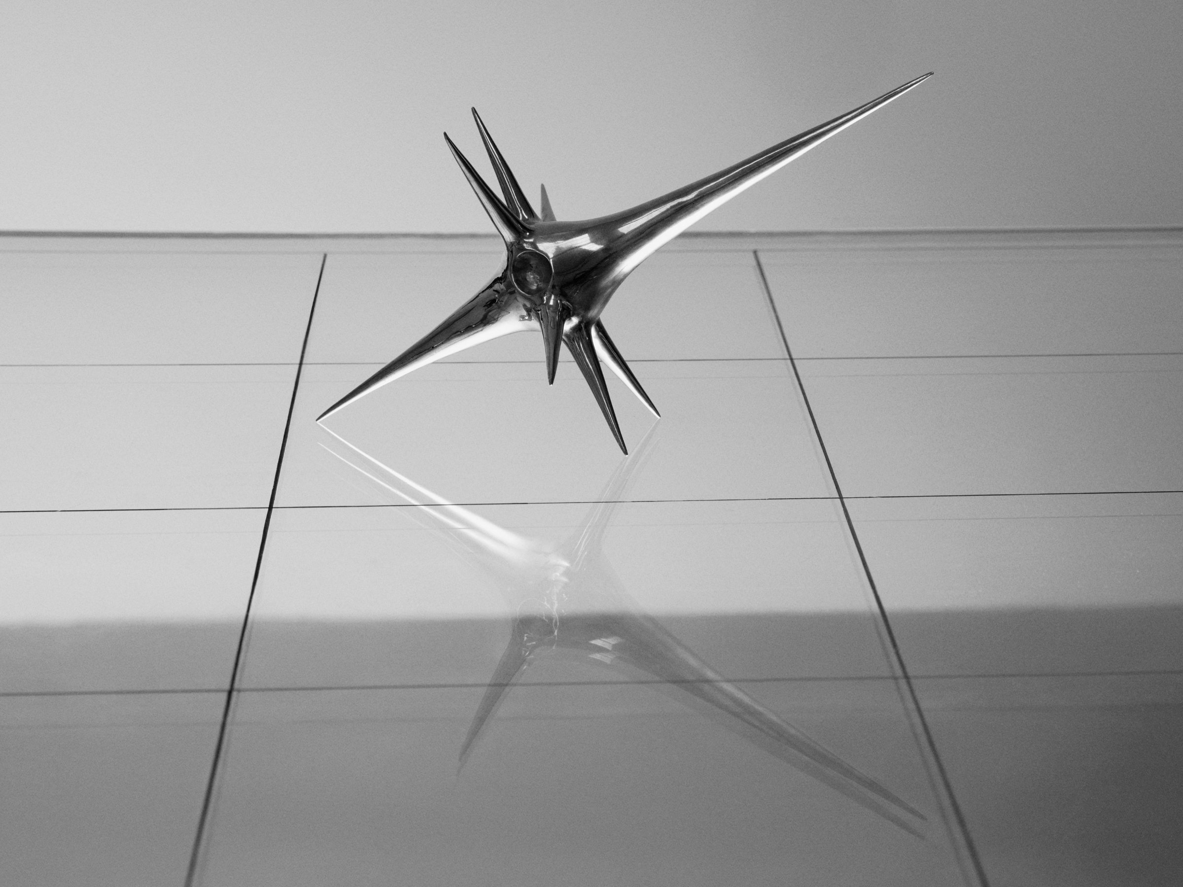 Harmonic Oscillators, art by Pilar Zeta, bronze resting pendulum sculpture photographed for L'Officiel Ibiza, 2026. Photo: Txema Yeste