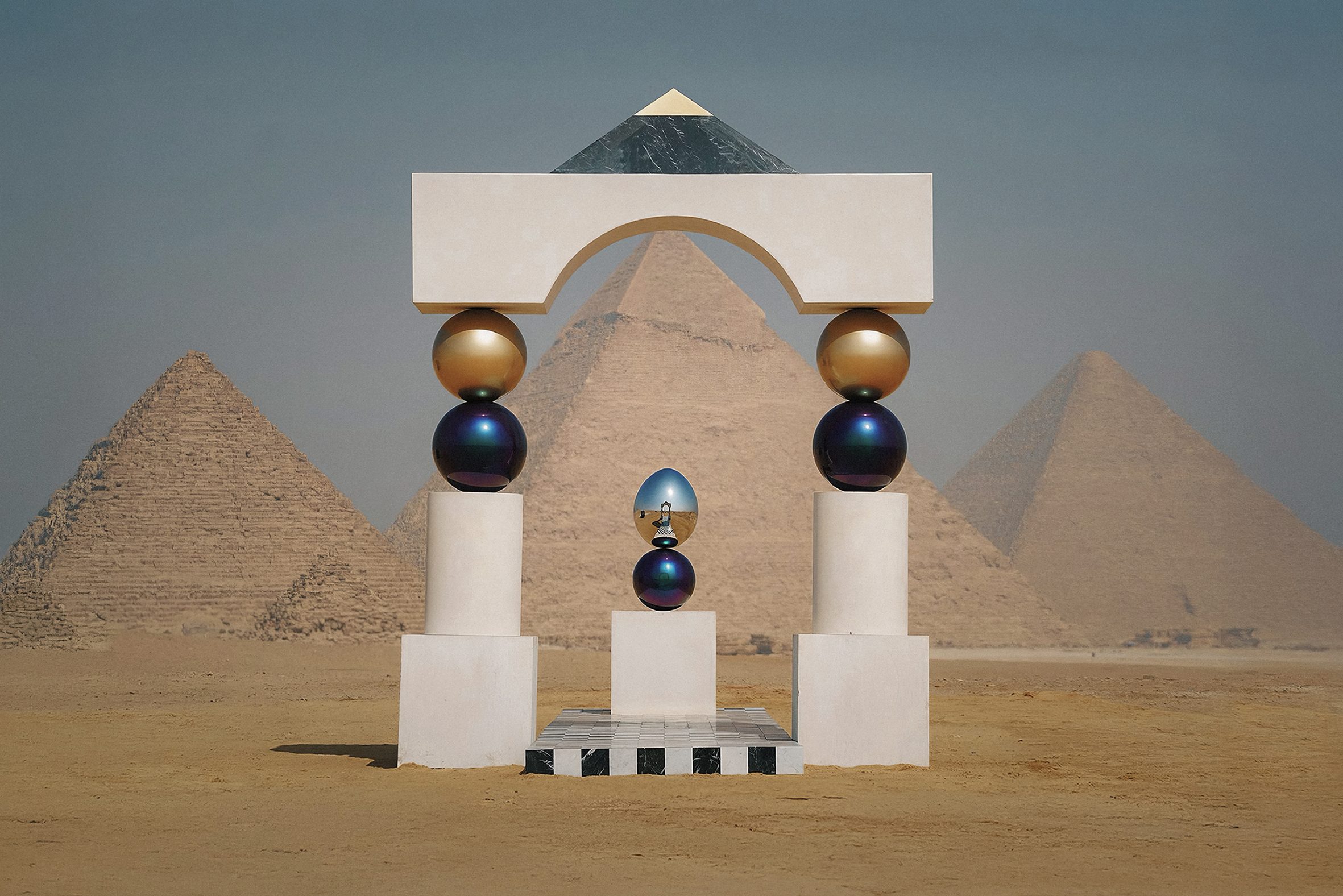 Mirror Gate, public art by Pilar Zeta. Monumental limestone and stainless steel portal installation for Forever Is Now at the Pyramids of Giza, Egypt