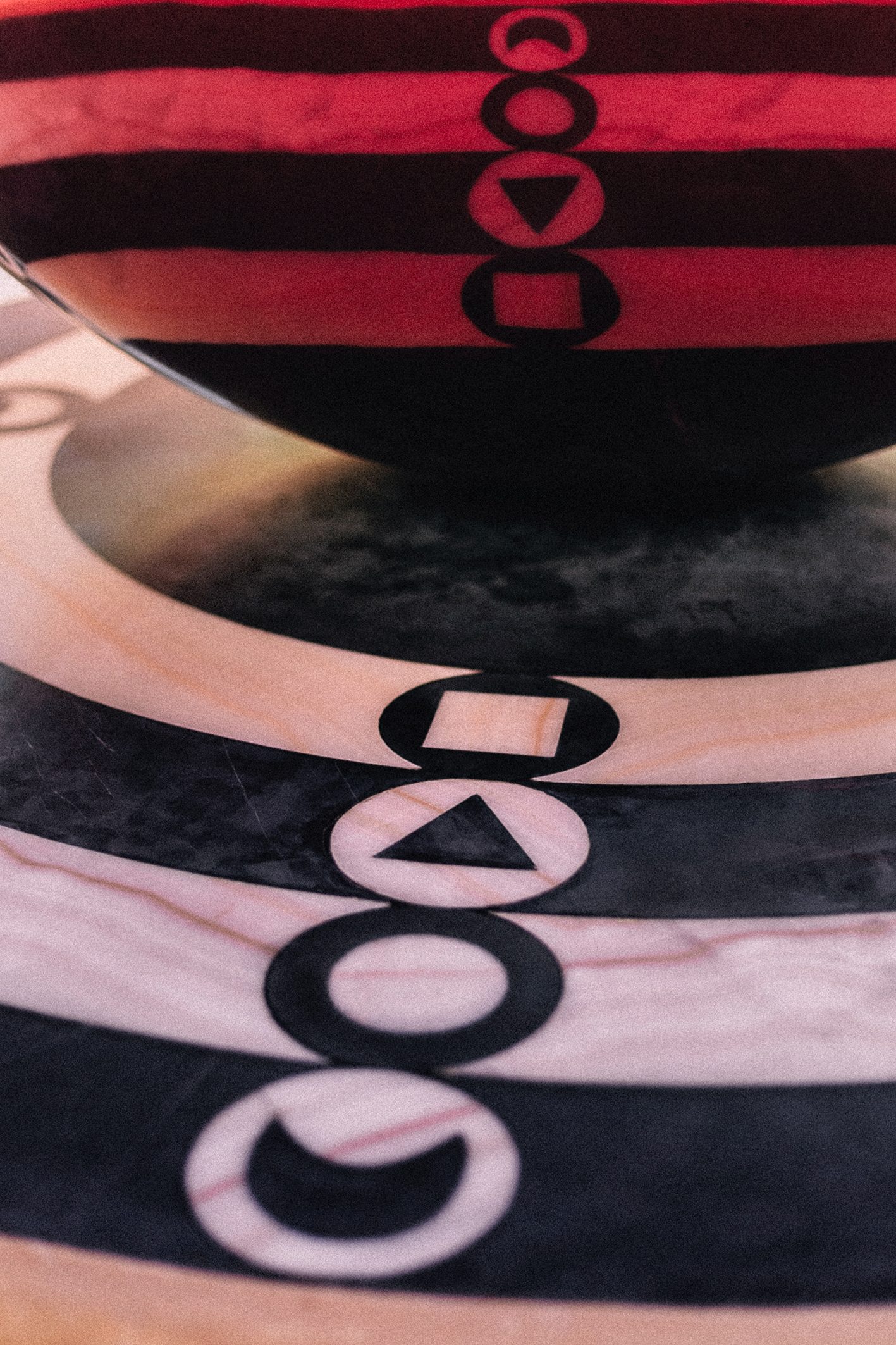 Portal del Éter Rojo, public art by Pilar Zeta, 2025. Permanent installation in stainless steel, marble and onyx with a red egg form, Tulum, Mexico