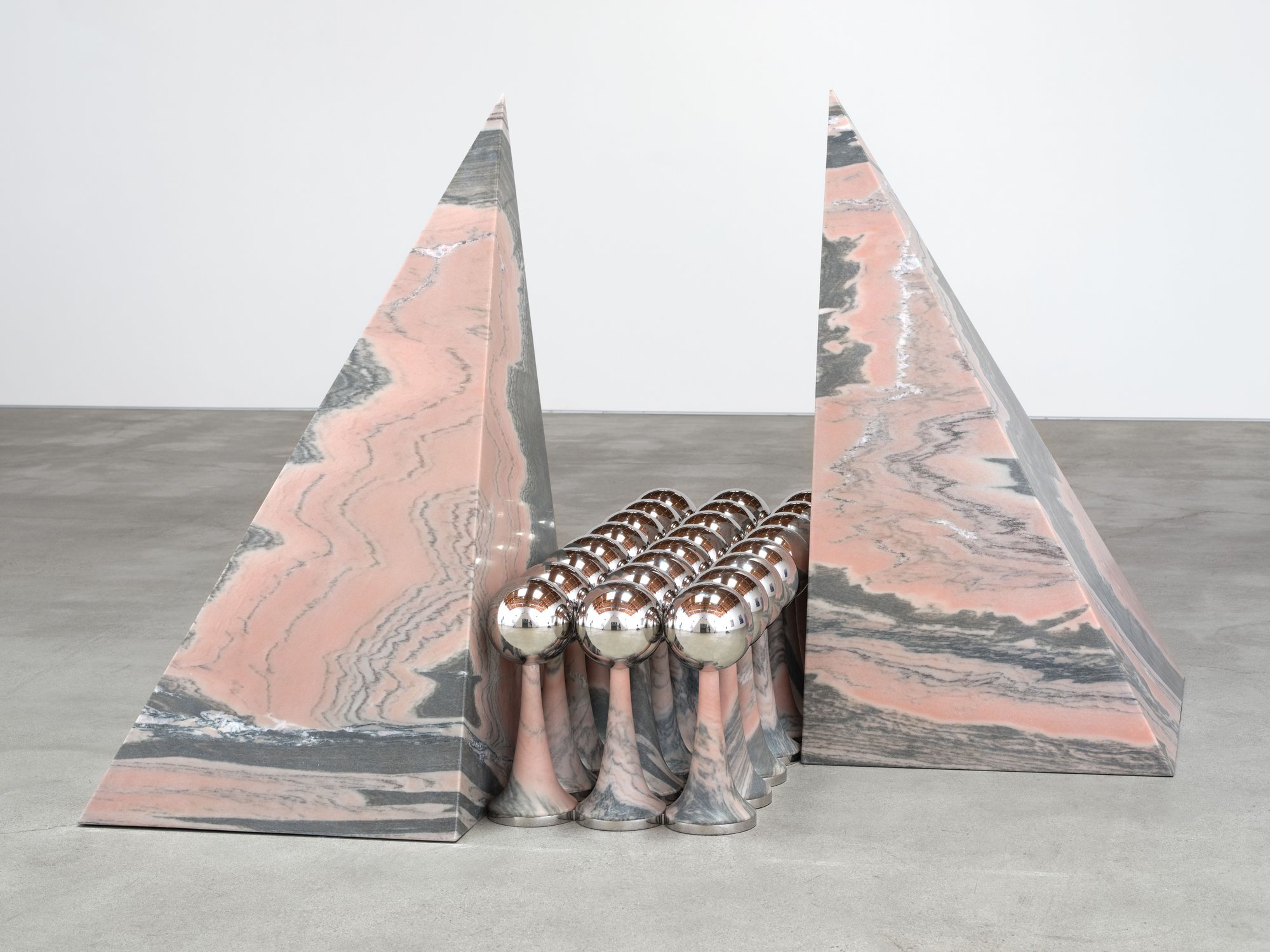 Telepathic Kiss Portal, art by Pilar Zeta, Portuguese pink marble and stainless steel, Perrotin Los Angeles, 2026