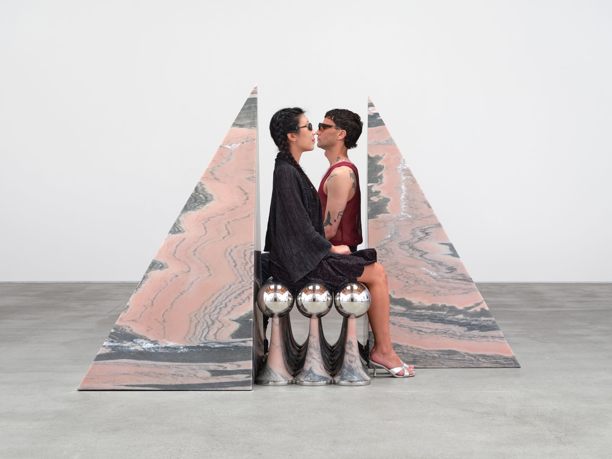 Telepathic Kiss Portal, art by Pilar Zeta, Portuguese pink marble and stainless steel, Perrotin Los Angeles, 2026