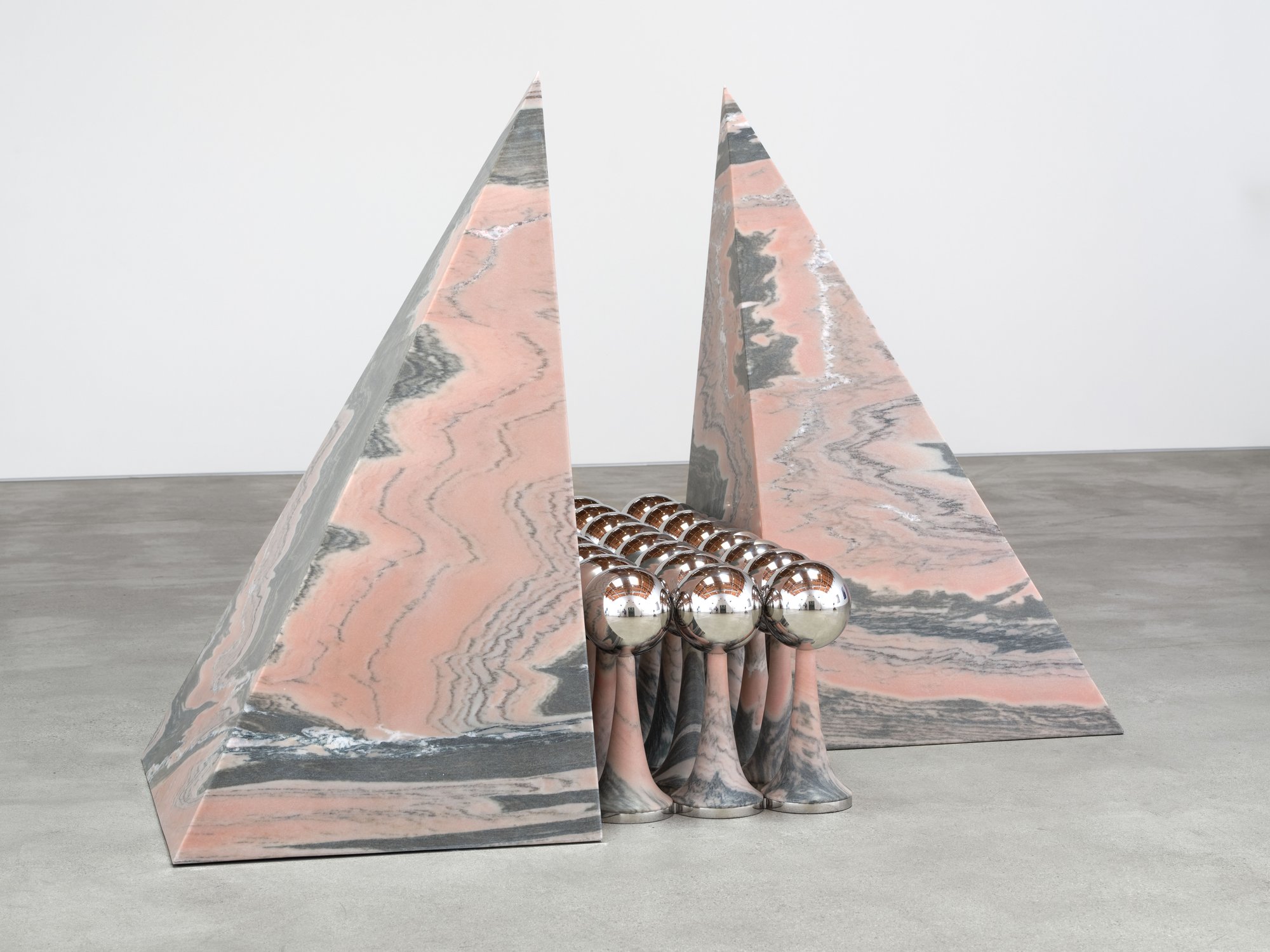 Telepathic Kiss Portal, art by Pilar Zeta, Portuguese pink marble and stainless steel, Perrotin Los Angeles, 2026