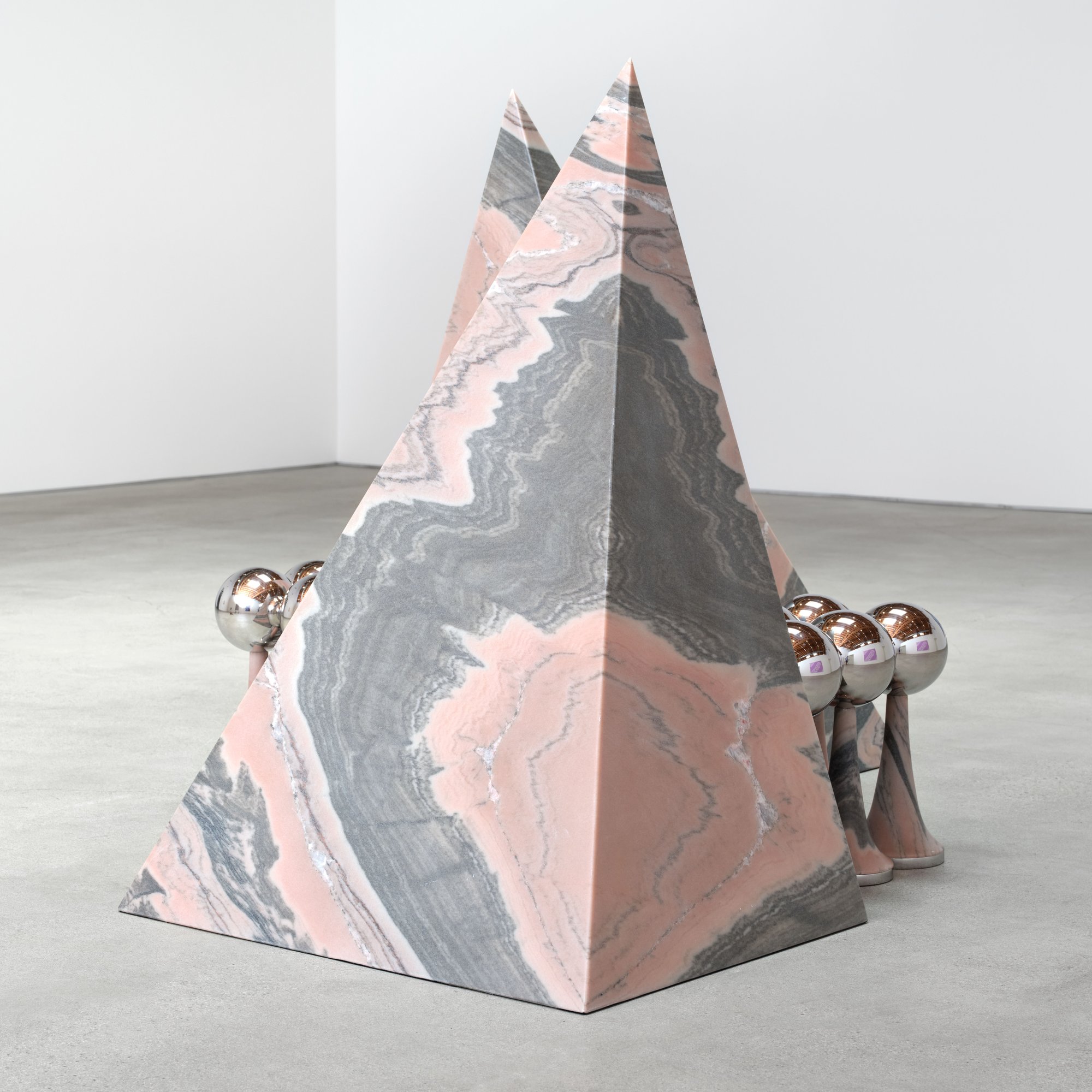 Telepathic Kiss Portal, art by Pilar Zeta, Portuguese pink marble and stainless steel, Perrotin Los Angeles, 2026