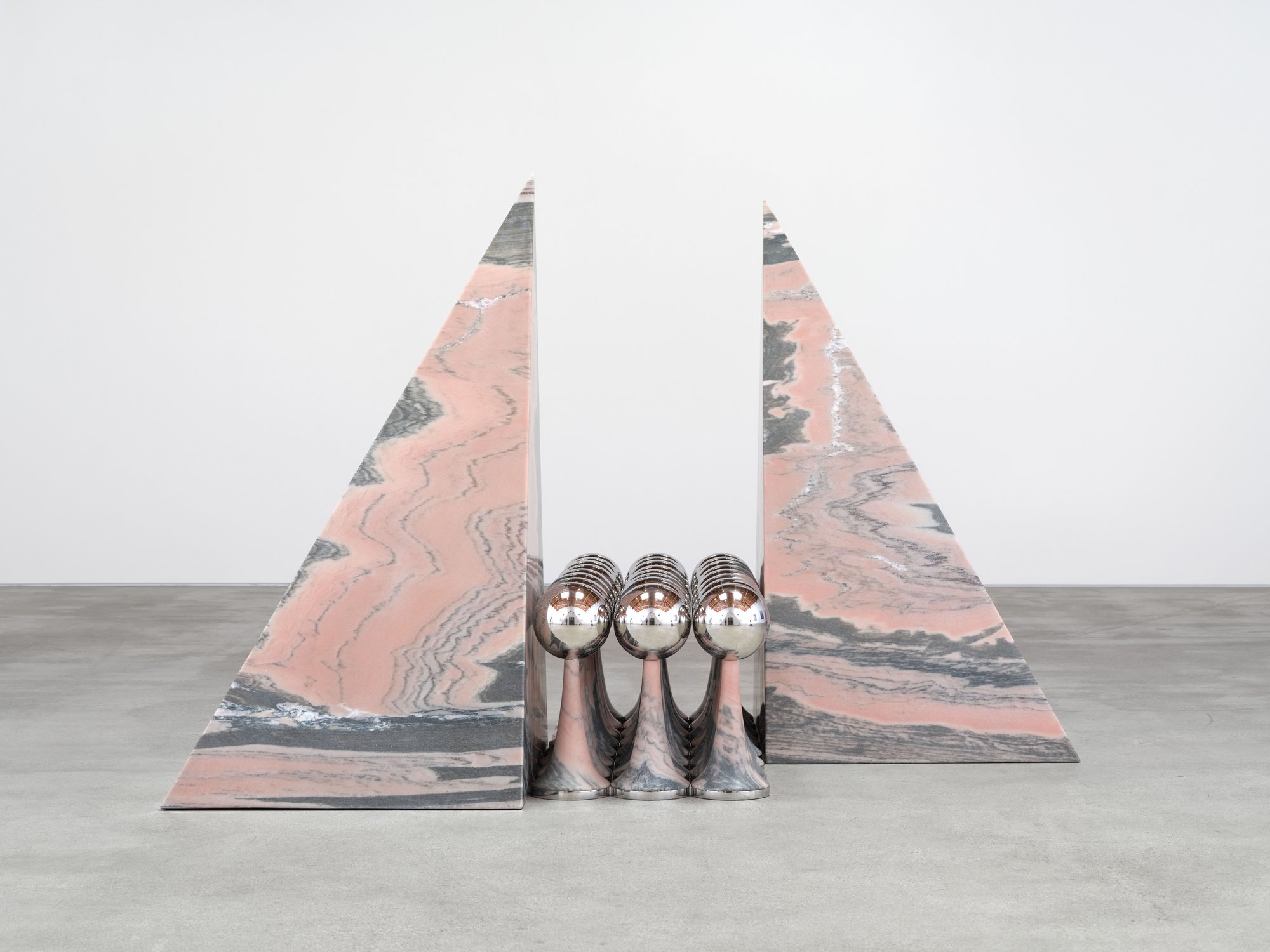 Telepathic Kiss Portal, art by Pilar Zeta, Portuguese pink marble and stainless steel, Perrotin Los Angeles, 2026