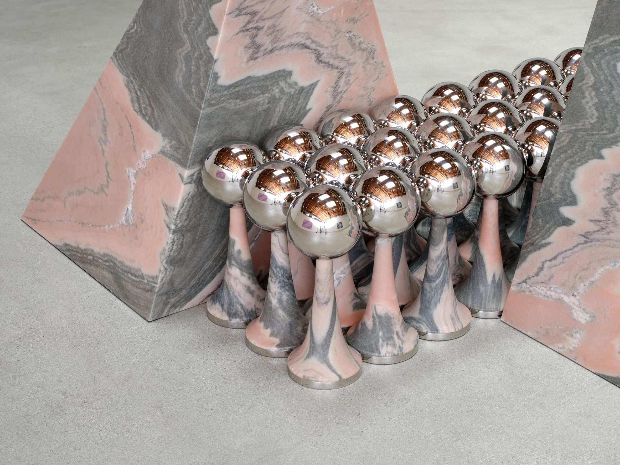 Telepathic Kiss Portal, art by Pilar Zeta, Portuguese pink marble and stainless steel, Perrotin Los Angeles, 2026